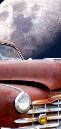 This phone live wallpaper showcases a vintage car, with the moon in the background adding to the peaceful ambiance