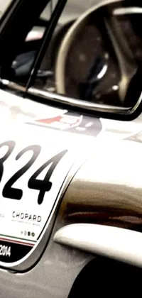 This live phone wallpaper showcases a sleek Porsche 356 sports car, complete with a bold numerical identifier on its side