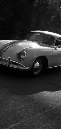 This phone live wallpaper showcases a timeless photograph of a classic Porsche 356 by Peter Basch