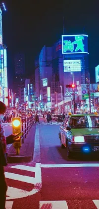 This live wallpaper depicts a bustling, nighttime city inspired by the vibrant landscape of Tokyo, Japan