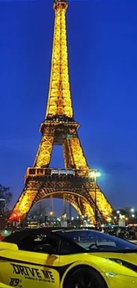 This live wallpaper shows a yellow sports car parked in front of the Eiffel Tower in Paris