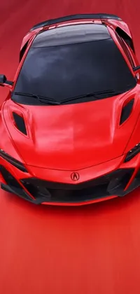 This red sports car phone live wallpaper features a Honda NSX driving on a red road