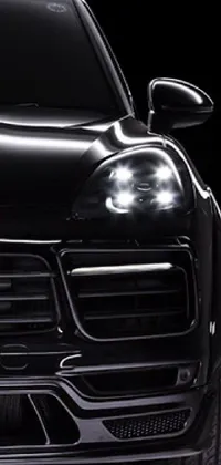 Rev up your mobile's screen with the black Porsche SUV live wallpaper