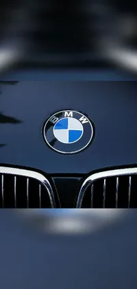 This live wallpaper for your phone features a close-up of the BMW logo on a car