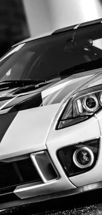 Looking for a stunning phone live wallpaper with a sporty touch? Check out this black and white photorealistic closeup of two iconic cars – a GT40 and a TVR Sagaris