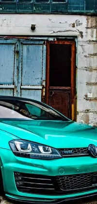 This live wallpaper showcases a stunning green sports car parked in front of a busy urban building