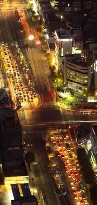 This live wallpaper shows an aerial view of a city at night