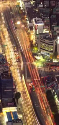 This eye-catching live wallpaper showcases an aerial view of a bustling metropolis at night
