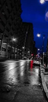 If you're a fan of urban life, this live wallpaper is perfect for you! Featuring a bright red fire hydrant on a dingy, rainy night city street, this wallpaper captures the desolate feeling of the urban landscape