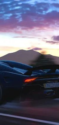 This dynamic live wallpaper features a sleek black sports car racing down a long and winding mountain road