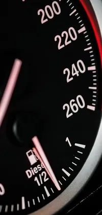 This phone live wallpaper features a high-definition close-up of a car's speedometer, showcasing the intricate details of the instrument