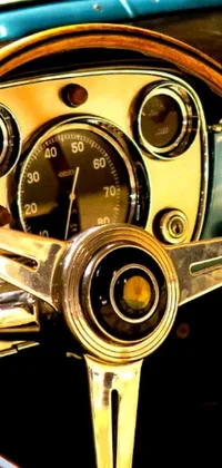 Featuring a close-up of a retrofuturistic Porsche 356 steering wheel, this live phone wallpaper is an opulent masterpiece with golden details
