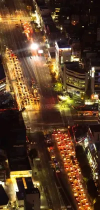 This live wallpaper showcases a lively city street at night