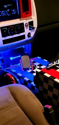 This phone live wallpaper features a retro car interior with a checkered table cloth, red and blue neon lights, led light strips, and blizzard sharp dynamic lights