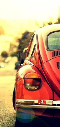 This live wallpaper features a stunning red VW Beetle parked on the roadside, with extraordinary HD detail delivering a magnificent 70s-style snapshot