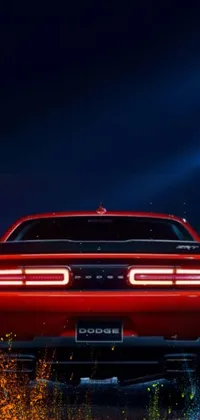 This live wallpaper showcases the rear view of a vivid red Dodge Charger, depicted in impressive digital art
