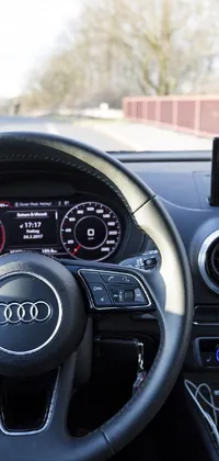 This stunning live wallpaper displays a close-up of a car's steering wheel with intricate textures and details, perfect for car enthusiasts