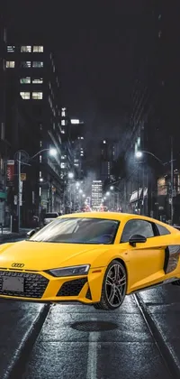 This phone live wallpaper showcases a yellow sports car parked on a city street