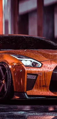 Rev up your phone with this photorealistic live wallpaper featuring an orange sports car parked in the rain