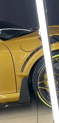 This phone live wallpaper features a beautiful yellow sports car parked in a garage, depicted through a hyperrealistic painting