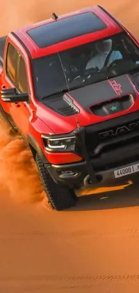 This live wallpaper showcases a striking red pickup truck on a journey through the desert