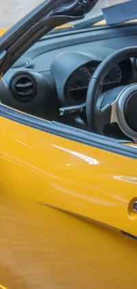 This live phone wallpaper features a striking yellow sports car in hyper-realistic detail