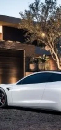This live wallpaper features a sleek white sports car parked in front of a modern house