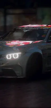 This live wallpaper features a stunning scene of a car driving on a race track at night