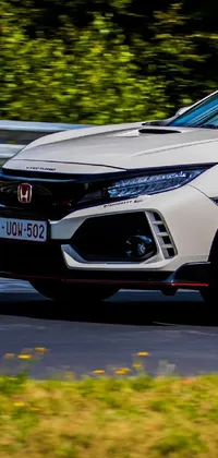This ultra-realistic live phone wallpaper features a white Honda Civic Type R racing around a track with incredible precision and agility