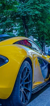 This dynamic phone live wallpaper showcases a vibrant yellow McLaren sports car parked curbside on a bustling Vancouver sidewalk