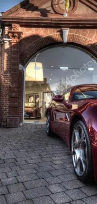 This live wallpaper features two sports cars in front of a church