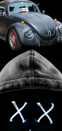 Looking for a stunning phone live wallpaper that exudes the perfect blend of edgy retrofuturism and sleek modern technology? Look no further than this amazing close-up of a hoodie, paired with a silhouetted car in the background