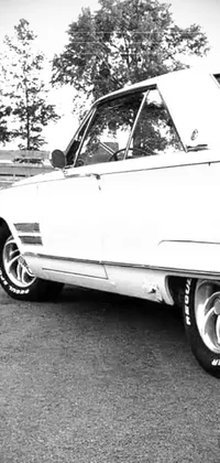 This live wallpaper showcases a captivating black and white photo of a classic car from 1966