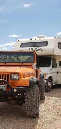 This live wallpaper depicts an orange jeep parked on the side of a dirt road, complemented by an RV