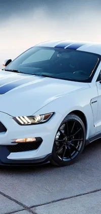Experience the timeless appeal of a White Ford Mustang through this dynamic phone live wallpaper