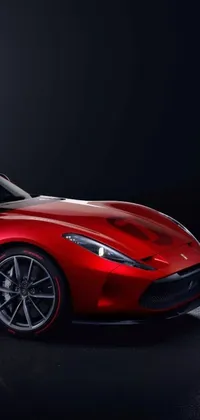 This dynamic phone live wallpaper showcases a bright red sports car parked in a dimly lit space with black and red details