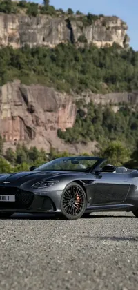 This stunning live wallpaper features a bold sports car being photographed by a man, creating a truly cinematic scene