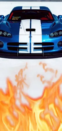 This excellent phone live wallpaper showcases a digital rendering of a blue and white car on fire positioned amidst mountain scenery