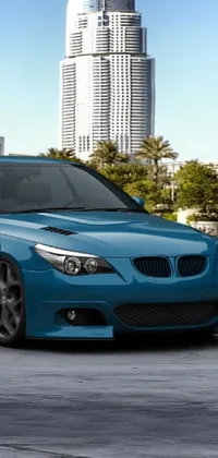 Introducing a stunning phone live wallpaper featuring a 3D render of a blue BMW car parked in a captivating parking lot against the backdrop of green trees