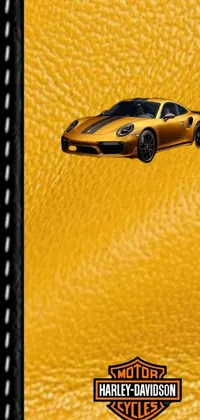 This live wallpaper for mobile phones features a close-up of a Porsche GT 3 speeding through a Hawaiian city with a yellow leather background inspired by auto-destructive art