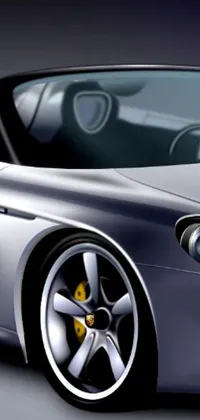This phone live wallpaper features a digital rendering of a silver sports car on a gray floor