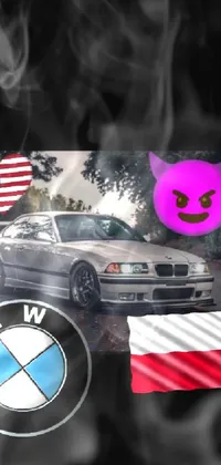 This dynamic phone live wallpaper features a sleek BMW parked by the side of an American flag on a scenic road