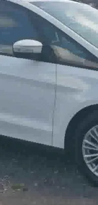Get a mesmerizing live wallpaper for your phone with a zoomed-in view of a high-detailed white Ford Fusion parked by the side of the road