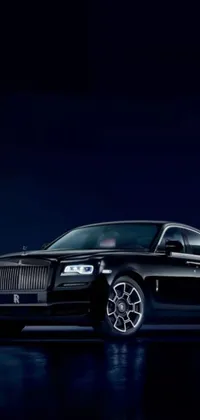 Display your love for luxury cars with this stunning live wallpaper featuring a black Rolls Royce parked in a dark setting