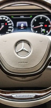 This live wallpaper showcases a stunning Mercedes Benz car, featuring a close up of the steering wheel