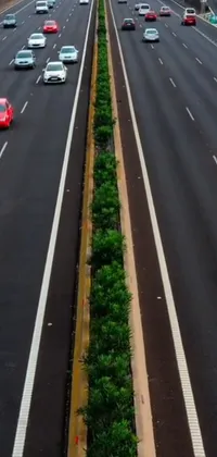 This phone live wallpaper showcases a bustling highway filled with moving cars