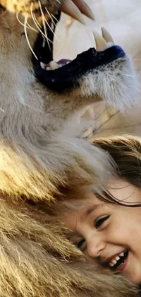 Enjoy a stunning live phone wallpaper capturing a heartwarming scene of a young girl hugging a large lion