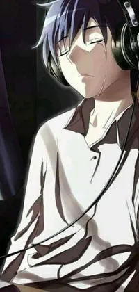 This phone live wallpaper features an animated full-body shot of a man with black hair sitting in front of a laptop wearing headphones