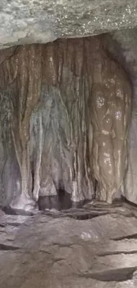 This phone live wallpaper features a mesmerizing and ancient cave landscape filled with ice and water