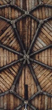 This phone live wallpaper is a stunning depiction of classic design, featuring an intricately detailed wooden ceiling, with chrome cathedrals and symmetrical elements adding to its aesthetic appeal